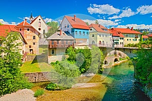 View of the Capuchin Bridge over the SelsÌŒka Sora River in the old city center of Å kofja Loka, Slovenia